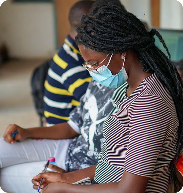 Lady wearing face mask while sitting