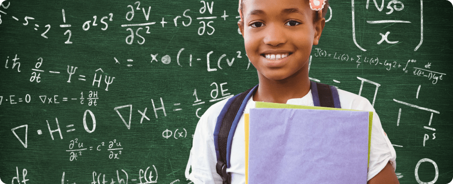 A smiling young African girl standing in a classroom, representing the goal of providing every child a future beyond the streets through education.
