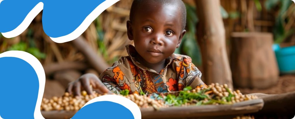 A young African boy standing in front of a plate of food with a somber expression, illustrating the urgent need for food security and World Hunger Day 2026 Africa initiatives.