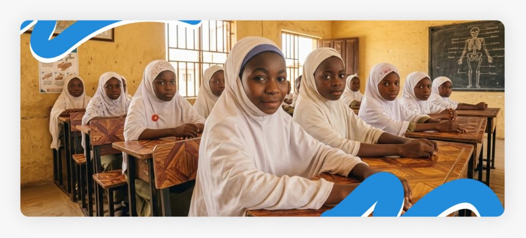 Happy young girl students sitting in their classroom and smiling softly after receiving support through charitable donations for schools in Africa.