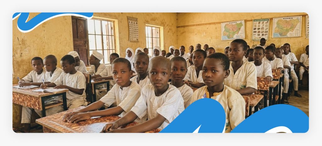 Young male primary school students sitting inside a classroom with expressions that show why they require critical humanitarian aid for children in Africa.