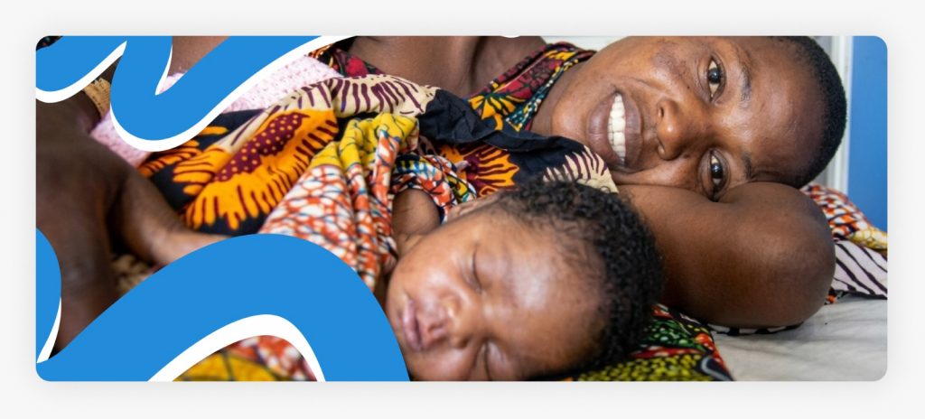 A healthy mother resting comfortably and lying down with her newborn baby in a community health center, demonstrating the life-saving results of support for maternal and newborn health in Africa.