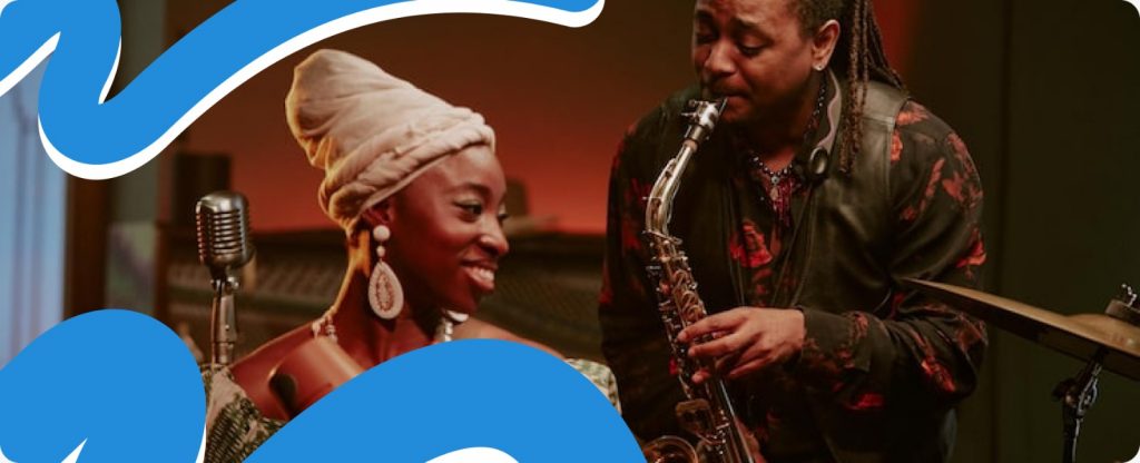 A man playing music for a woman during a community session, demonstrating the power of creative expression in community mental health Africa 2026.