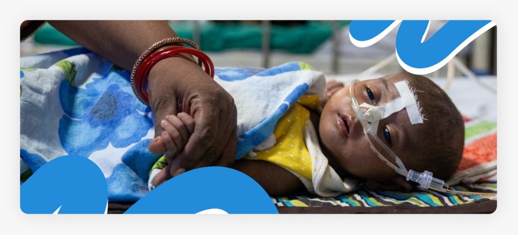 A fragile newborn infant in a rural clinic appearing still but struggling to breathe, highlighting the need for immediate support for dying babies in Africa.