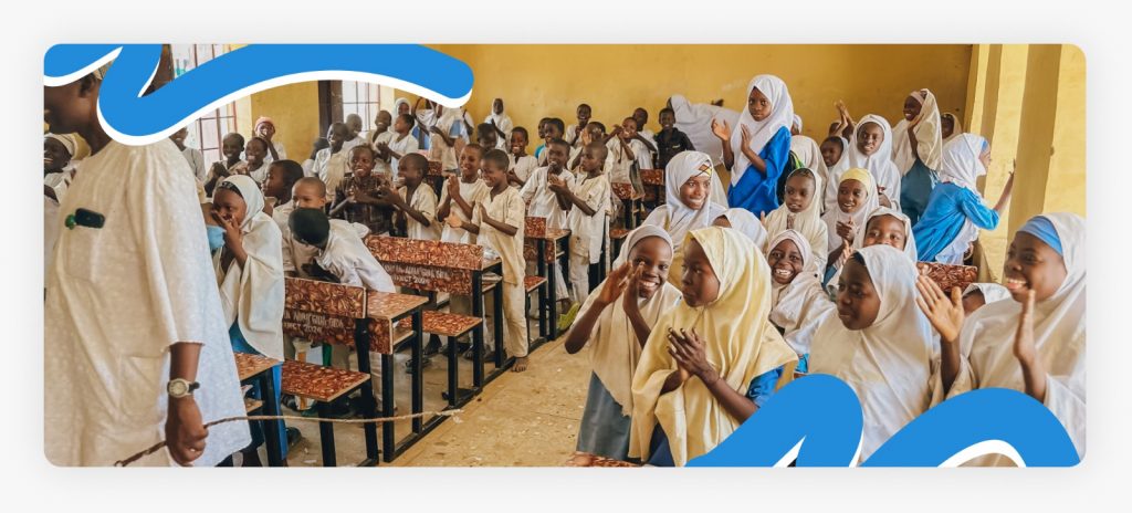 Many primary school students standing up along the classroom walls due to a total lack of desk space, illustrating the final proof of our crisis with crowded classrooms.